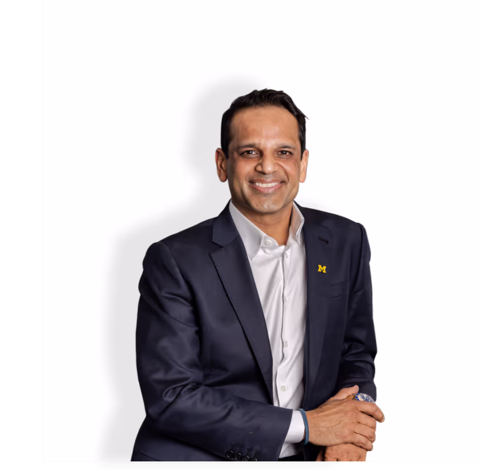 Man in suit smiling confidently