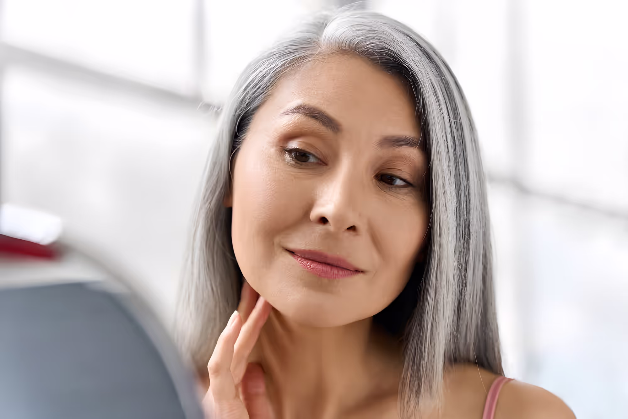Woman posing with long silver hair