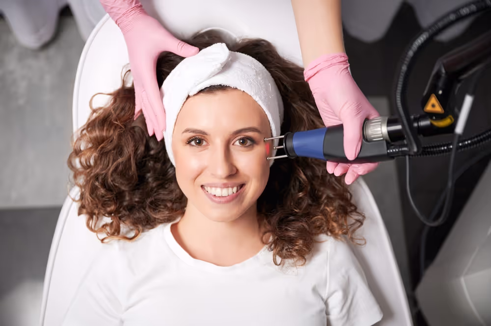 Woman relaxing during facial treatment